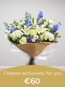 Hand tied bouquet made with seasonal flowers.