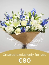Hand tied bouquet made with seasonal flowers